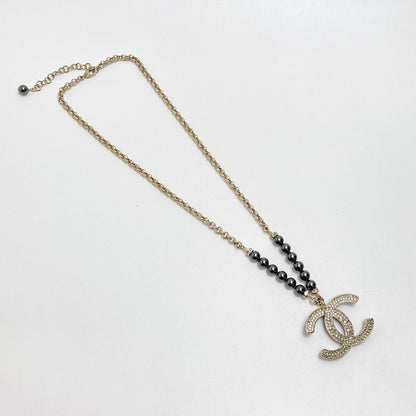 Chanel Coco Mark Rhinestone X Fake Pearl Necklace C23p Champagne Gold/black