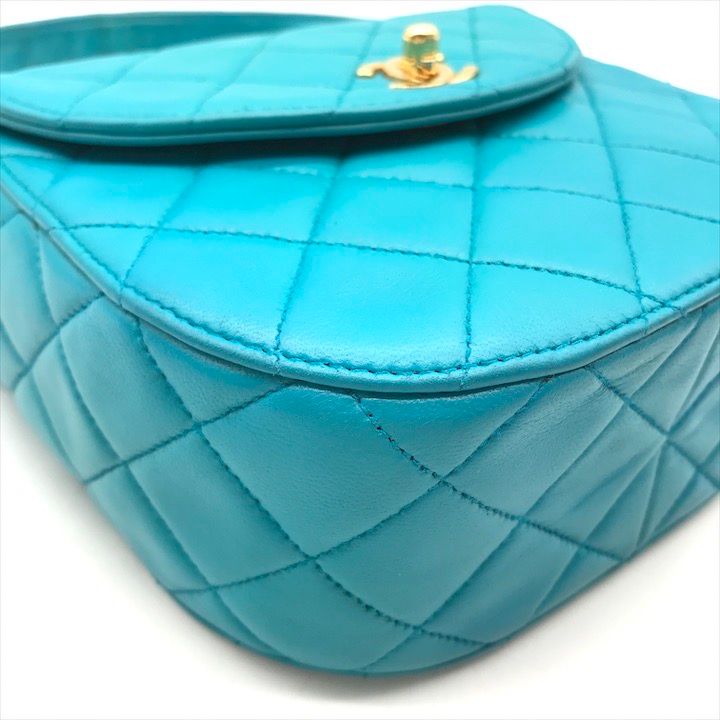 Chanel CC Logo Turnlock Quilted Lambskin Mini Hand Vanity Bag Blue