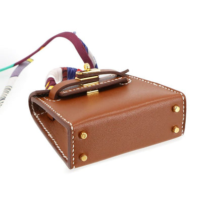 Exhibit Hermes Kelly Twilly Mini Bag Charm Tadelakt Fauve W Engraved Kelly