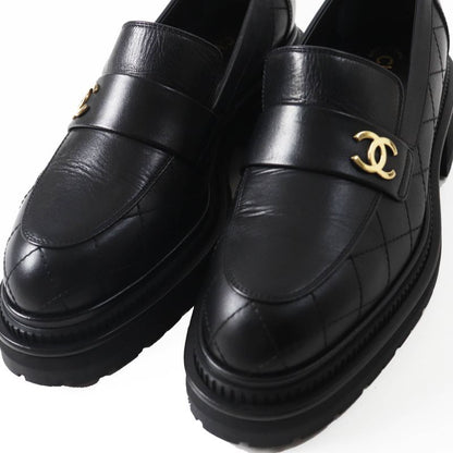 CHANEL 23A G45074 Matelasse Coco Mark Leather Loafers Black Gold Hardware 39.5