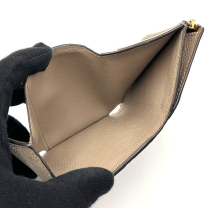 Louis Vuitton Monogram Empreinte Zoe Trifold Wallet Tourterelle