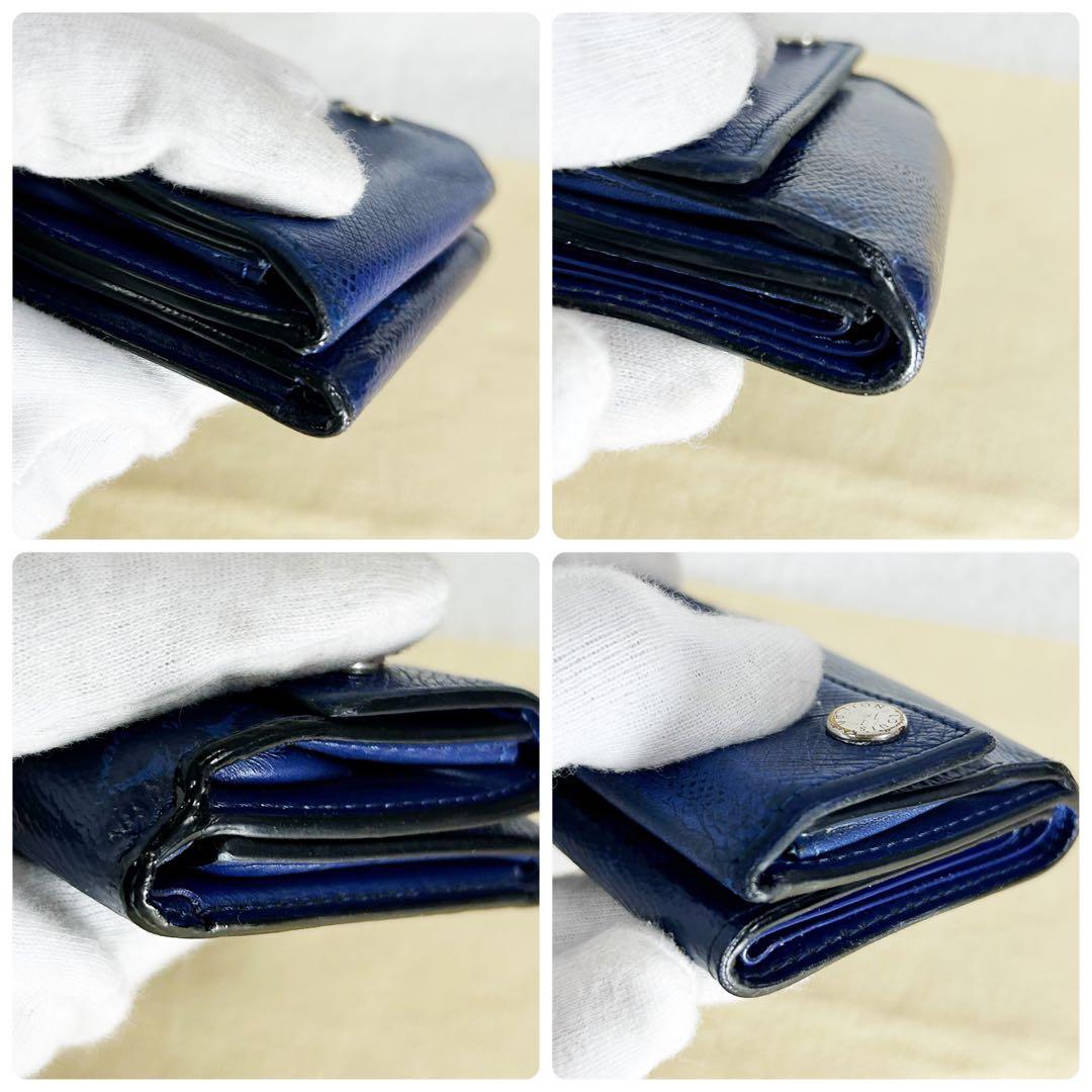 Louis Vuitton Discovery Taiga Llama Compact Trifold Wallet