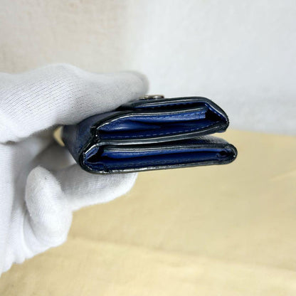 Louis Vuitton Discovery Taiga Llama Compact Trifold Wallet