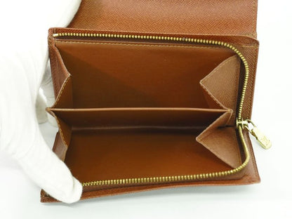 Authentic Louis Vuitton LV Porte Monet Vier Trésor Monogram Fold Wallet Brown