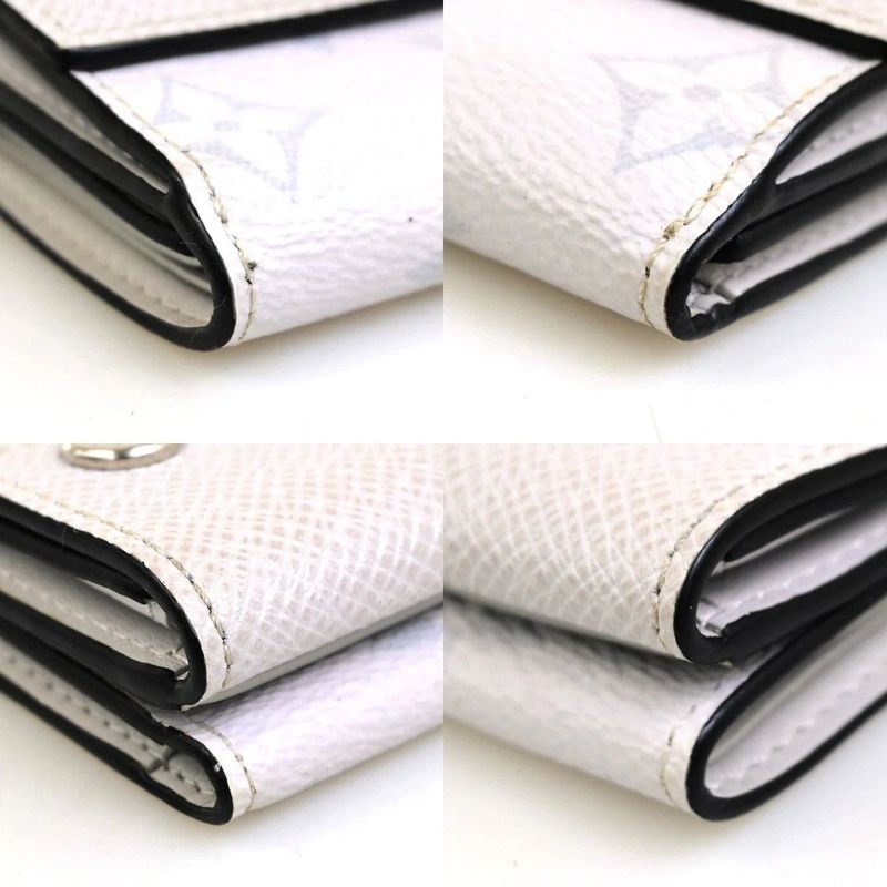 Louis Vuitton Trifold Wallet Taiga Llama Discovery Compact M67621 39fa050