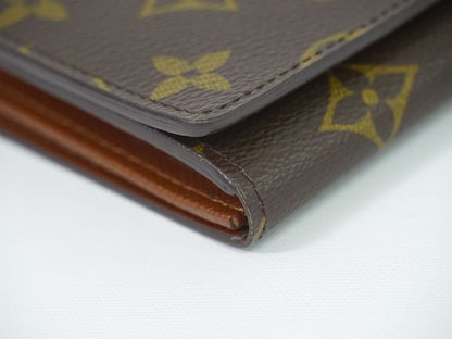 Authentic Louis Vuitton LV Porte Monet Vier Trésor Monogram Fold Wallet Brown